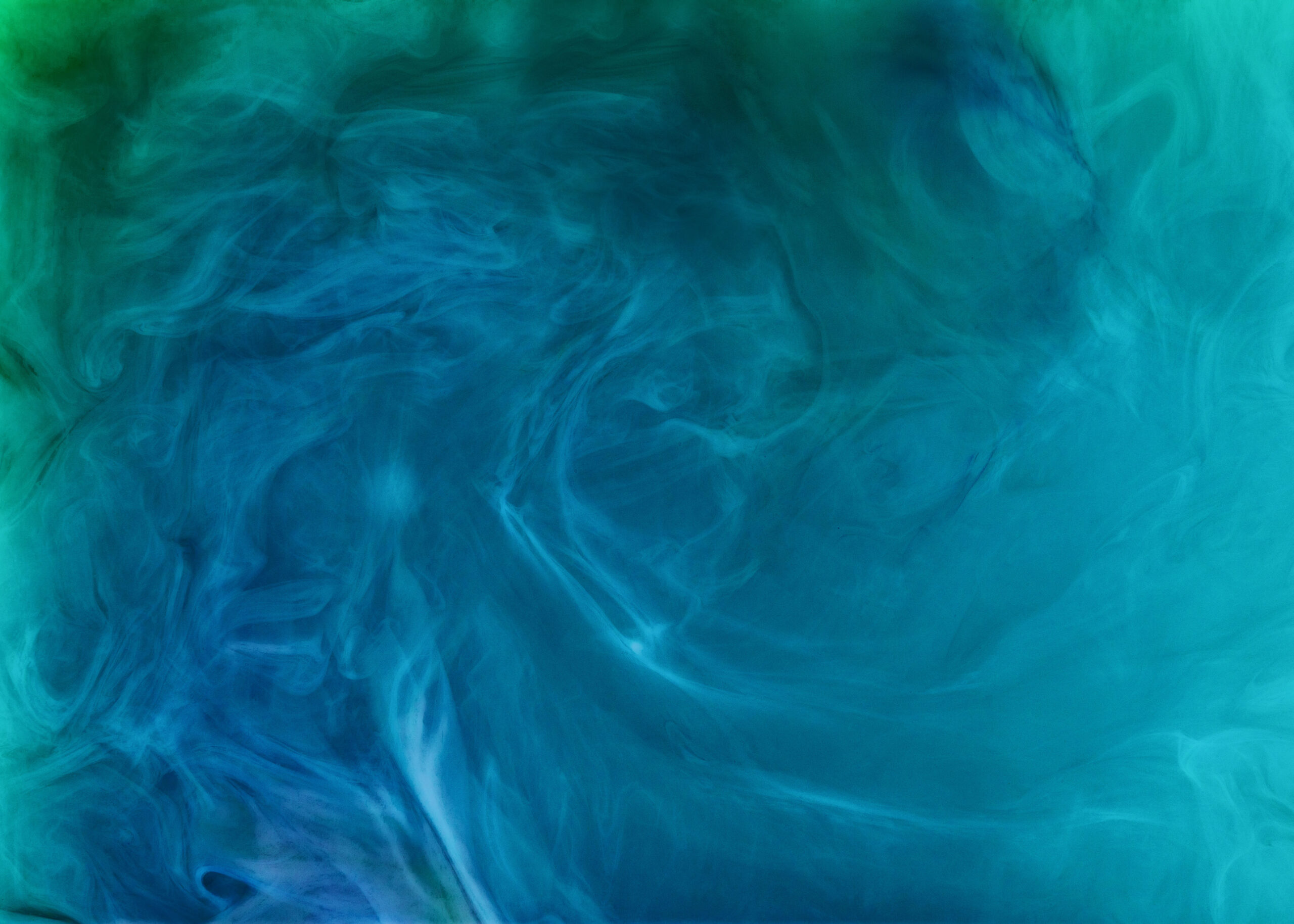 creative background with blue flowing and swirling paint